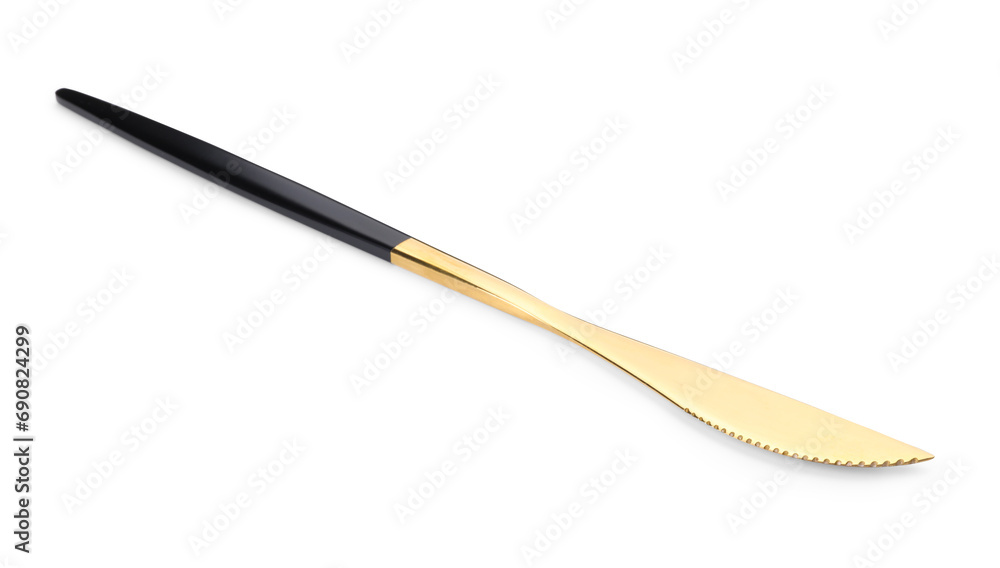 One shiny golden knife with black handle isolated on white One shiny golden knife with black handle isolated on white