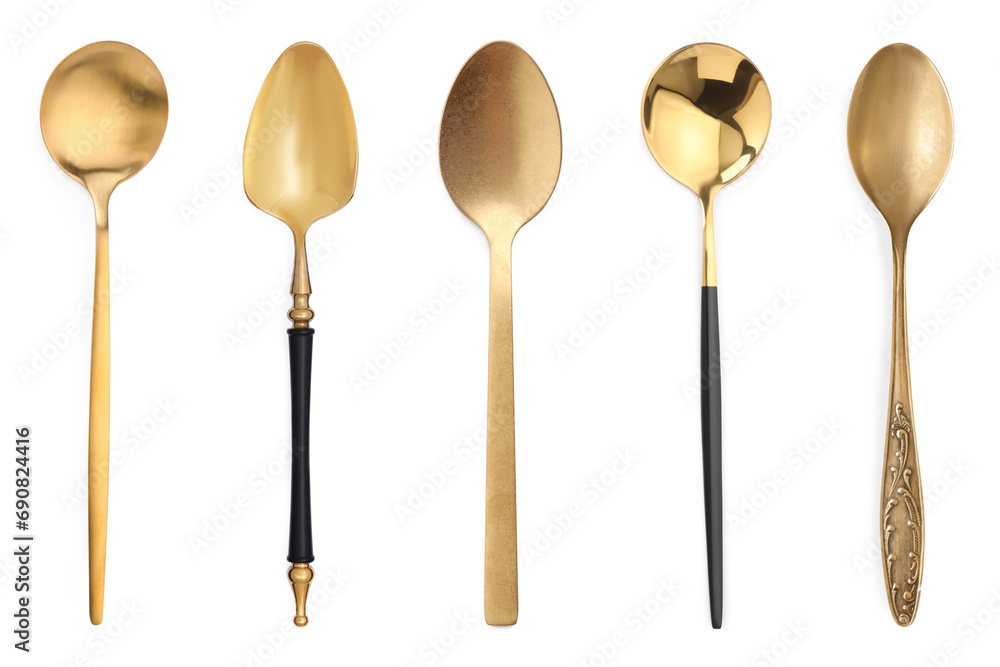 Different stylish golden spoons on white background Different stylish golden spoons on white background