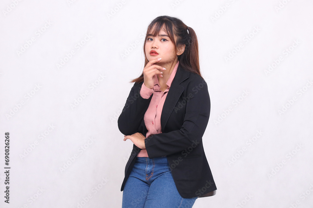 Beautiful happy Asian office woman in her 20s frowning wearing casual suit shirt working professionally tilted right holding chin on white background studio portrait for banner ad, banner, billboard Beautiful happy Asian office woman in her 20s frowning wearing casual suit shirt working professionally tilted right holding chin on white background studio portrait for banner ad, banner, billboard