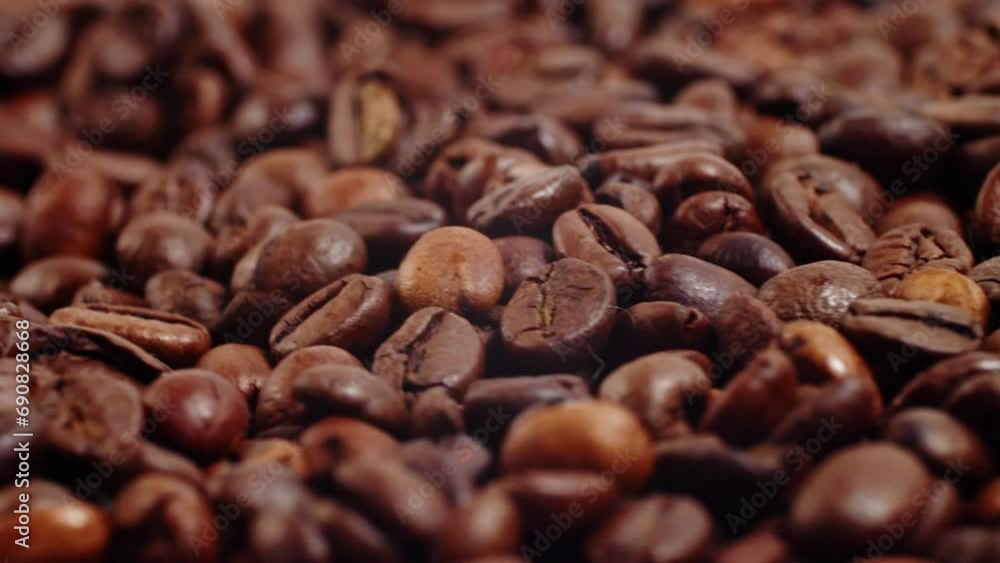 Close up of roasted brown coffee beans rotating Background roasted coffee beans Close up of roasted brown coffee beans rotating Background roasted coffee beans