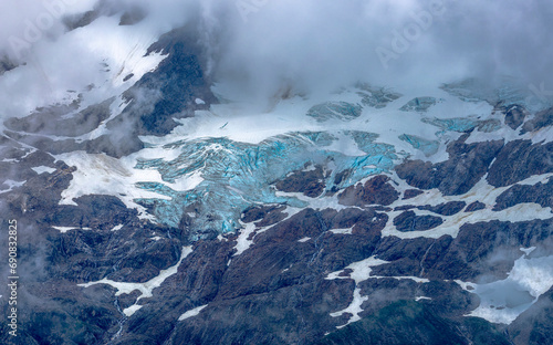 Fototapeta Naklejka Na Ścianę i Meble -  Mountain Top with Ice, Snow and Clouds - Alaska