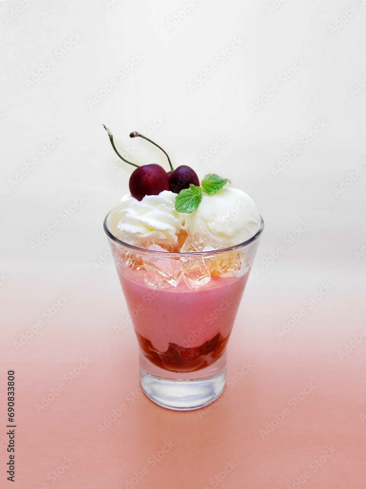 This is an image of a strawberry pink drink. Berry smoothie. milkshake. Ice cream and cherry are on top. The background is also a pink gradation. Cool and refreshing. Taken from slightly above This is an image of a strawberry pink drink. Berry smoothie. milkshake. Ice cream and cherry are on top. The background is also a pink gradation. Cool and refreshing. Taken from slightly above
