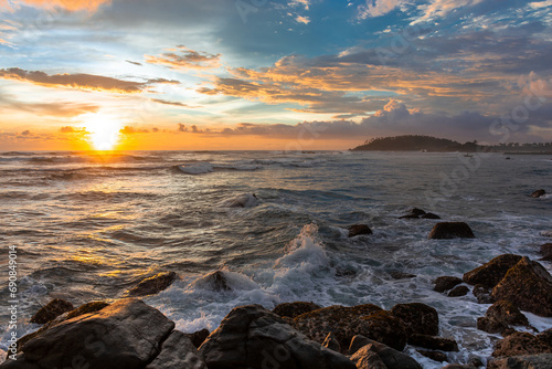 Beautiful sunset on the Indian Ocean coast on the island of Sri Lanka, Mirissa. © ArturSniezhyn