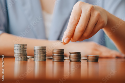 businessman holding coins putting in glass. concept saving money for finance accounting