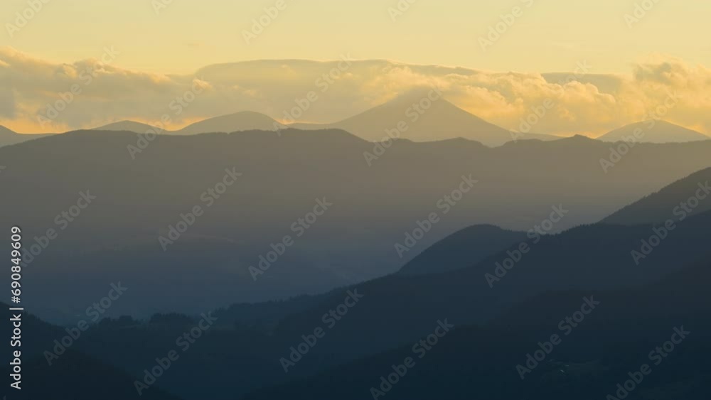 Time-lapse of old peasant homes on hillside. Amazing mountain landscape. Colorful sunset in wild national park highlands with dark spruce woods Time-lapse of old peasant homes on hillside. Amazing mountain landscape. Colorful sunset in wild national park highlands with dark spruce woods