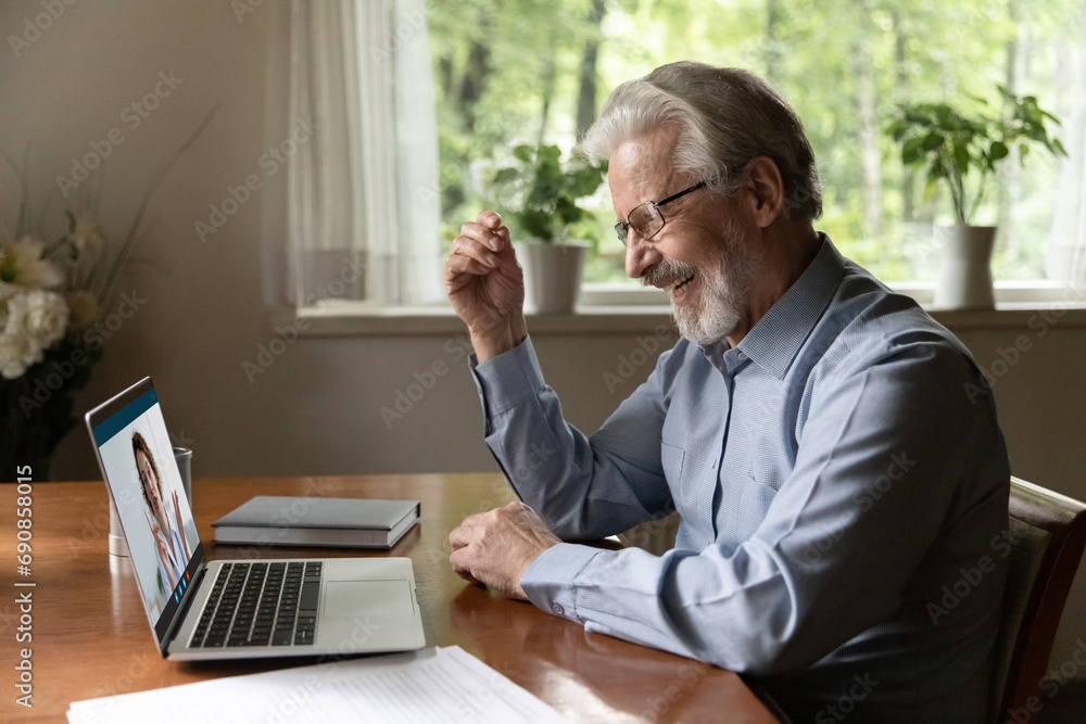 Telemedicine. Energetic smiling elderly man grandfather having virtual consultation online with young female doctor gp. Woman medic check health status of senior man patient by videocall using laptop Telemedicine. Energetic smiling elderly man grandfather having virtual consultation online with young female doctor gp. Woman medic check health status of senior man patient by videocall using laptop