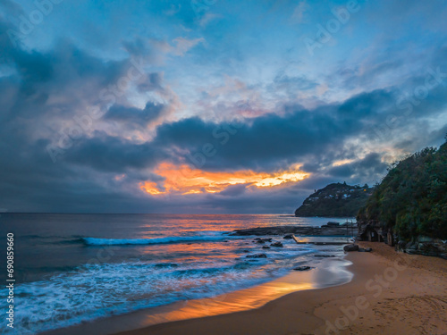 Northern Beaches Sunrise at the seaside with rain clouds © Merrillie
