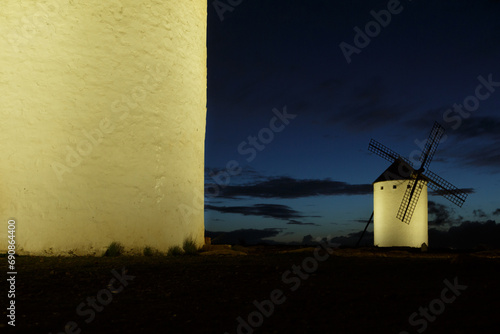 Night photography of illuminated windmills in Campo de Criptana, Ciudad Real. Castilla la Mancha photo