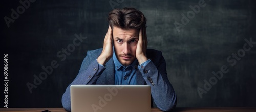 A concerned male employee about head posture