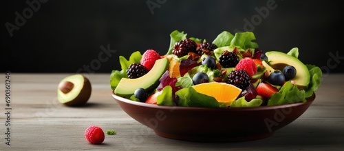 Salad with fruits  avocado  and mustard dressing