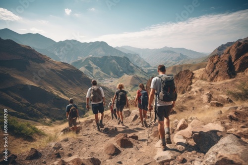 Photo of a group of diverse hikers exploring a rugged mountain trail. Generative AI © Aditya