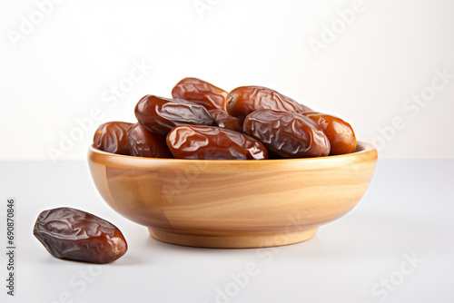 Dates in a wooden bowl on a white background generative AI