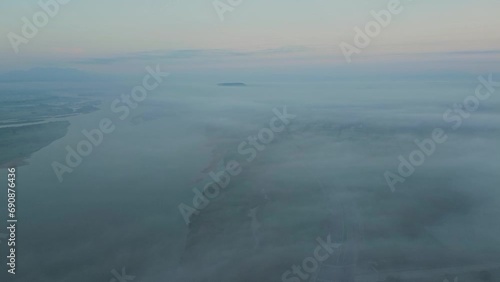 Wallpaper Mural Aerial landscape of village in Vietnam with river and road covered by morning fog. Torontodigital.ca