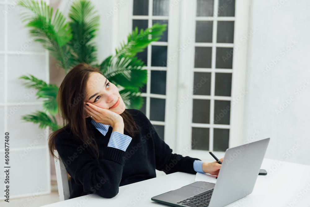 Business woman working on laptop online finance in office Business woman working on laptop online finance in office