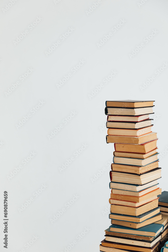 Stacks of educational books in university library on white background Stacks of educational books in university library on white background