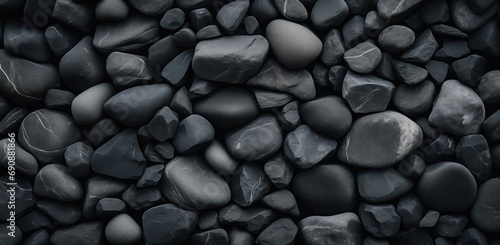 grey slate coloured rocky stones piled together, top down perspective texture wallpaper photo