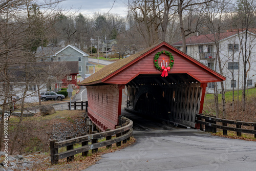 Historic timber one lane covered bridge in the Town of Newfield, Tompkins County NY with holiday lights.	 photo