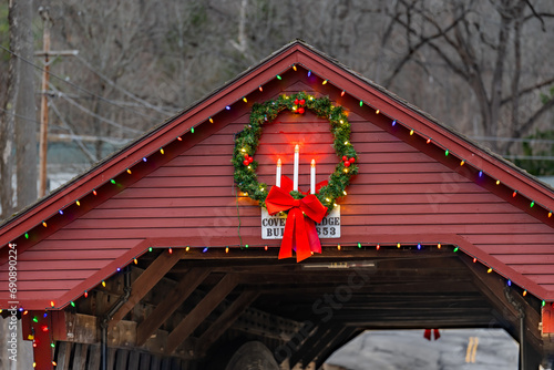 Historic timber one lane covered bridge in the Town of Newfield, Tompkins County NY with holiday lights.	 photo