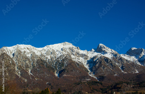 The first snow in the mountains of Alpago in the province of Belluno Italy