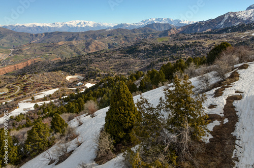 slopes of Amirsoy mountain resort in early spring(Tashkent region, Uzbekistan)	 photo