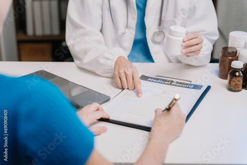 patient filling insurance legal document at appointment with doctor. patient signing medical treatment contract, agreement form for taking medic care service, consultation, therapy