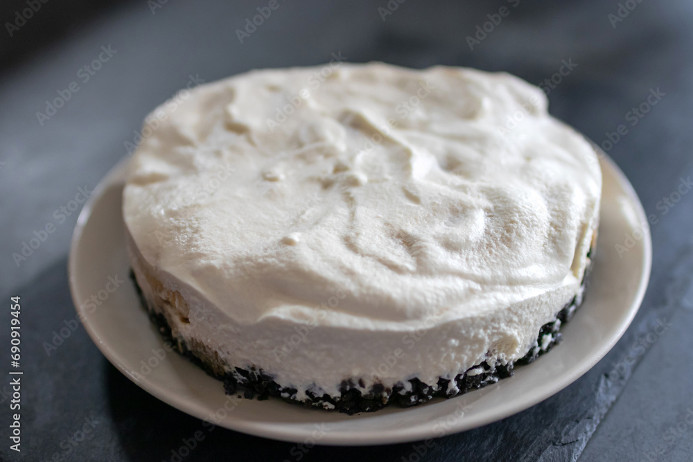 Classic banoffee pie a simple cookie crust is filled with thick caramel, slices of fresh banana and whipped cream on top. 
