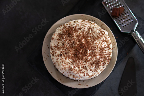 Classic banoffee pie a simple cookie crust is filled with thick caramel, slices of fresh banana and whipped cream on top. 