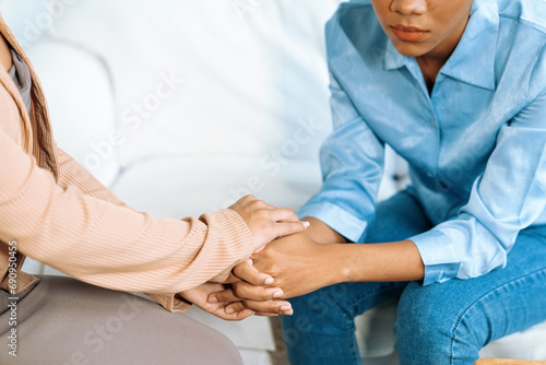 Close up shot of supportive and comforting hands for cheering up depressed patient person or stressed mind with crucial empathy