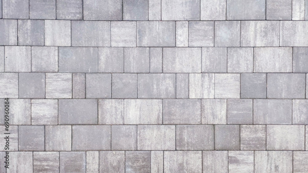 Closeup of a gray textured surface made from paving stones. Closeup of a gray textured surface made from paving stones.