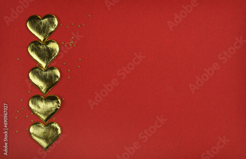 Golden hearts in a vertical...