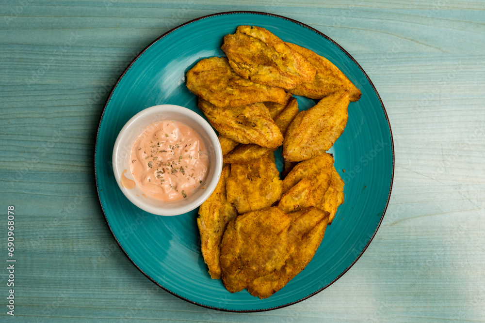 Deep fried plantains with dipping sauce Deep fried plantains with dipping sauce
