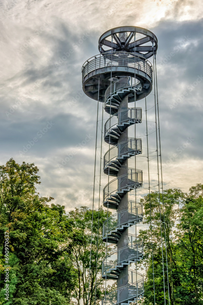 Round metal observation tower with sky background