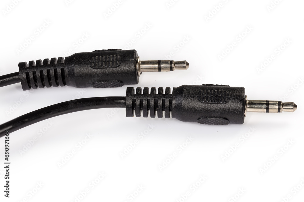 Mini stereo connectors on audio cable edges on white background Mini stereo connectors on audio cable edges on white background