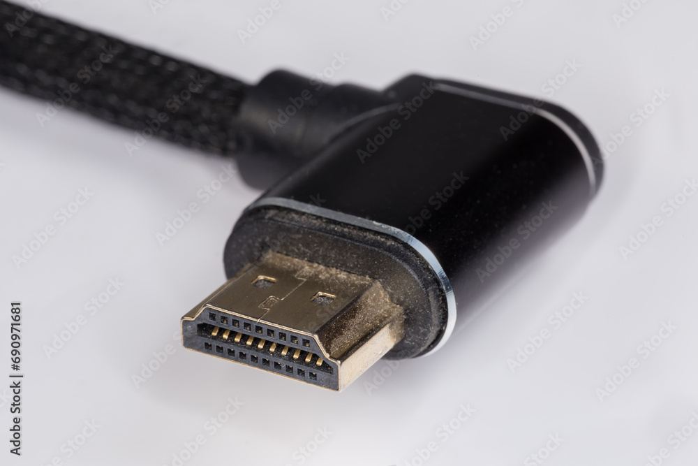 Full-size HDMI connector on used cable edge close-up Full-size HDMI connector on used cable edge close-up