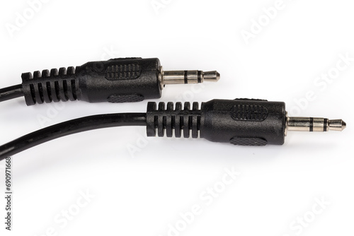 Mini stereo connectors on audio cable edges on white background