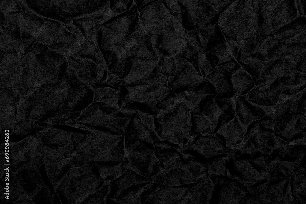 Black wrinkled paper texture background Black wrinkled paper texture background