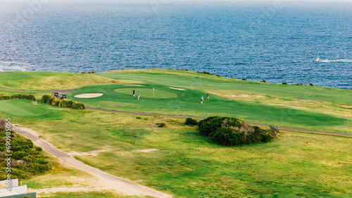 Aerial view from a drone of Litlle Bay Beach, hidden between rocks and a golf course. Located in Australia, Sydney.
