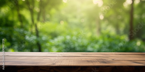 Banner with wooden table with planks and blurry nature background
