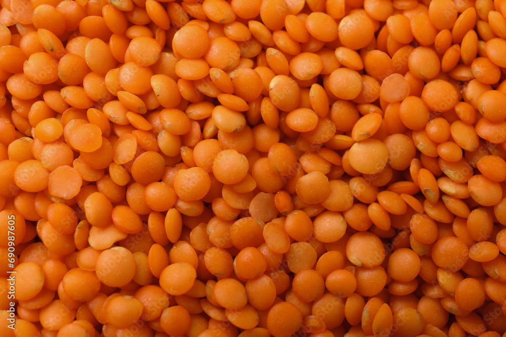 Heap of raw lentils as background, closeup view