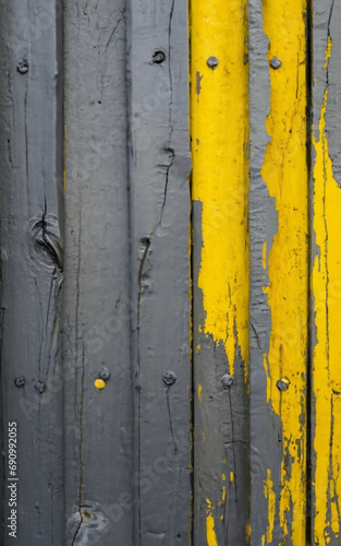 Old wooden wall painted in yellow, gray and black colors. Abstract background. Generative Ai