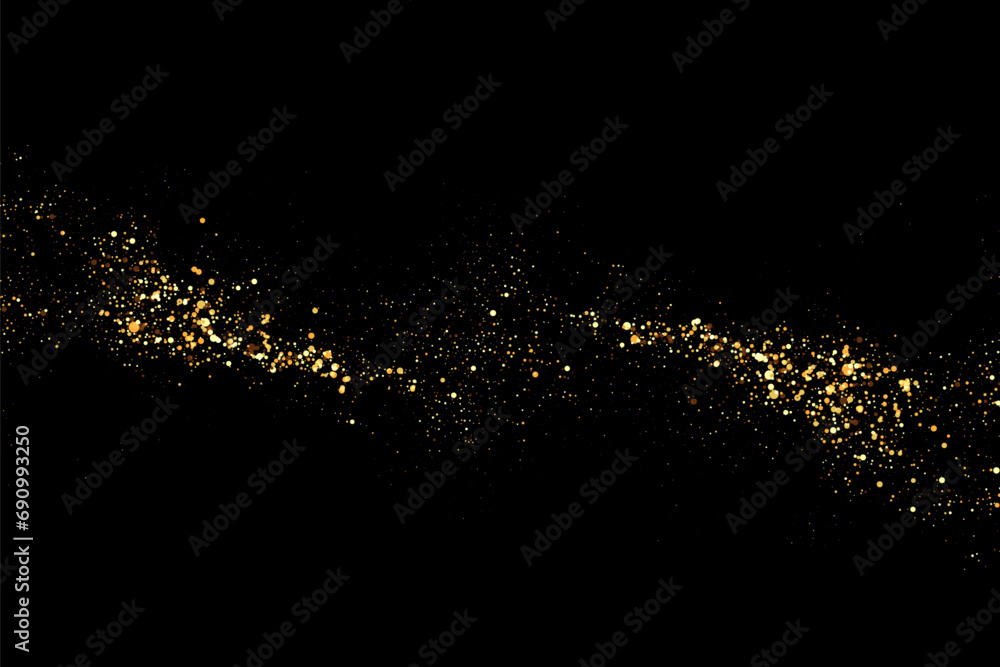 Scattered golden particles on a dark background. Festive background or design element.