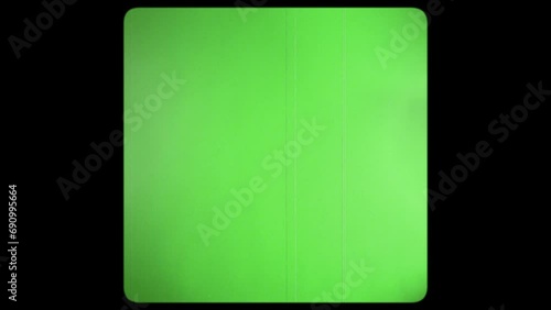Vintage TV chromakey. Interference and flickering retro TV. Green screen with rounded edges and damaged film tape. 8mm.