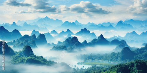 the mountains are shown in a blue sky and soft mist photo