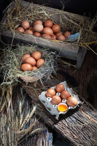 chicken eggs basket in carton box and Broken egg with yolk