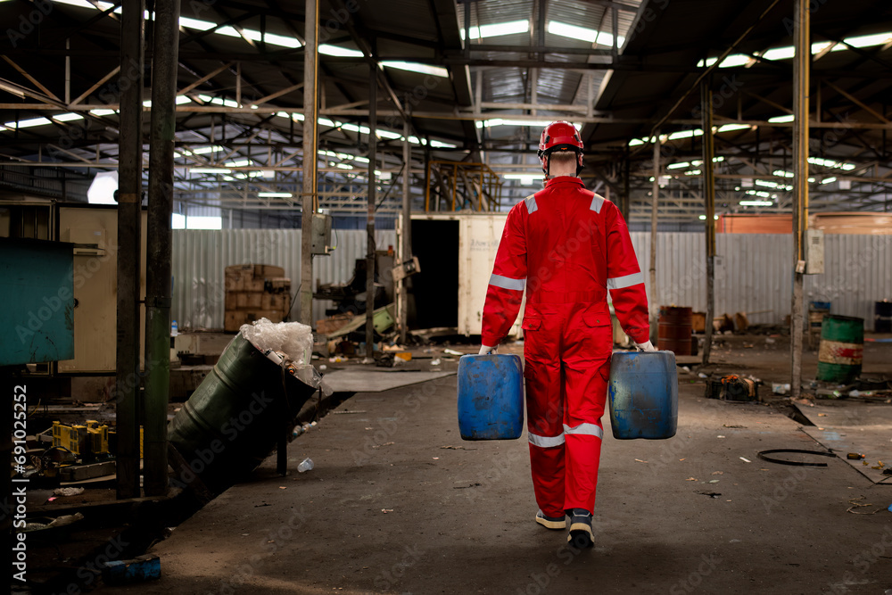 Engineer or worker industry wearing safety uniform ,white gloves and gas mask under checking chemical tank is industry factory safety concept.	