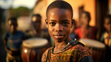 a South African boy playing a traditional percussion instrument, the rhythm and beats reflecting the rich cultural heritage of his community. 