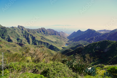 The Barranco de Tahodio is one of the great ravines of Anaga. Tenerie, Canary Islands. In the background the capital of the Island of Tenerife and its port photo