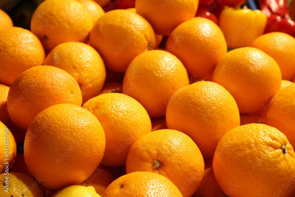 Heap of fresh oranges on counter at market, closeup Heap of fresh oranges on counter at market, closeup
