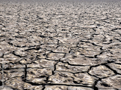 Dried mud during drough caused by the global warming and climate changes photo