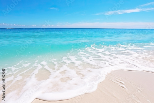 Beautiful sandy beach and soft blue ocean wave © Oranuch